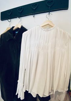 A feminine piece with drape and flow, contrasted with pleats and structured stitching - giving it a balance of movement and shape, that allows you to play it up or play down.  A slightly exagerated longer sleeve with understated ruffle detail at the shoulder and neckline,  hints at another era, but the modern horizontal lines across the chest,  steal it back to now.   A comfortable and suprisingly versaitille wear! * These pieces are my own pre loved fashion staples, from my own closet.  I use only natural cleaning products, and never dry clean. ** Accessories not included, but may be available in other listings. Fitted Tops With Pleated Sleeves For Daywear, Pleated Tops For Daywear In Fall, Classic Pleated Blouse For Fall, Classic Pleated Tops For Fall, Billowy Tops For Daywear In Fall, Billowy Tops For Fall Daywear, Fall Classic Pleated Tops, Pintuck Tops For Daywear In Fall, Fall Daywear Tops With Pintucks