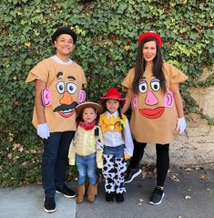 three adults and two children dressed up in costumes