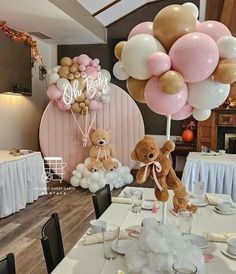 there are balloons and teddy bears on the table