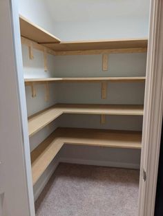 an empty walk in closet with shelves and no one on the shelf to see what is inside