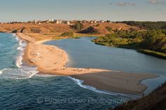 an aerial view of a beach and the ocean