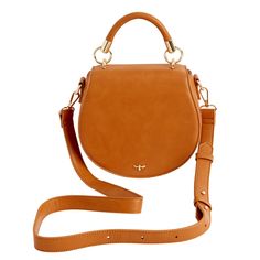 Crafted from certified vegan leather in classic tan, this curved satchel design evokes a sense of country life, reminiscent of a classic equestrian saddle bag. Complete with a top handle, an adjustable cross-body strap and a magnetic fastening, all designed to keep your most precious treasures safe and secure. Wipe clean with damp cloth Classic Saddle Bag With Adjustable Strap For On-the-go, Classic Crossbody Saddle Bag For On-the-go, Timeless Everyday Saddle Bag With Detachable Handle, Classic Everyday Saddle Bag With Detachable Handle, Brown Satchel With Round Handle For On-the-go, Timeless Brown Saddle Bag With Gold-tone Hardware, Classic Saddle Bag With Detachable Handle, Timeless Saddle Bag With Detachable Strap For Everyday Use, Timeless Satchel Saddle Bag For Everyday