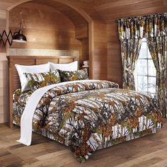 a bed in a room with wooden walls