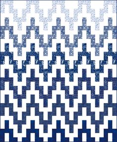 a blue and white quilt with an abstract design on the front, in two rows