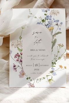 a wedding card with flowers on it