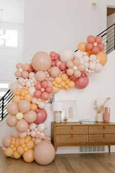 a staircase made out of balloons in the shape of an airplane on top of a wooden floor