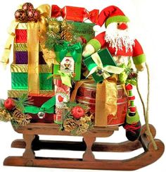 a wooden sleigh filled with lots of christmas decorations and gifts on top of it