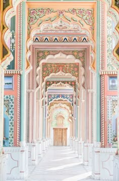 an ornate archway in the middle of a building with colorful paint on it's walls