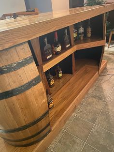 a wooden bar with several bottles on it