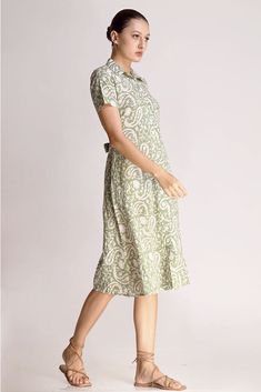 The Alicia shirt midi dress is a springtime staple. Crafted with care from cotton, its charming block print adds flair to its warm green shade. Featuring a collared design and front button closure, this jade short-sleeve maxi dress exudes casual elegance. With two handy pockets, it's as practical as it is stylish, making it perfect for effortless chic on sunny days.Material: Cambric - 100% cottonStyle/Print: Hand Block PrintNumber of Pockets: 2Length: 45 inchesOccasion: CasualColor: Jade Summer Cotton Maxi Shirt Dress, Casual Midi Dress With Collared Neckline For Daywear, Spring Collared Midi Dress With Relaxed Fit, Fitted Maxi Length Cotton Shirt Dress, Summer Green Cotton Shirt Dress, Fitted Cotton Maxi Shirt Dress, Green Cotton Shirt Dress For Spring, Green Fitted Midi Shirt Dress, Green Cotton Shirt Dress For Summer