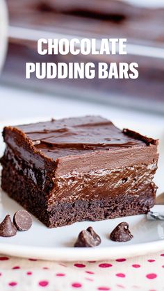 chocolate pudding bars on a white plate with spoons and napkin in the background text reads, chocolate pudding bars