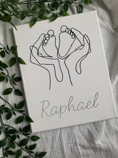 a drawing of two hands holding each other with the word raphael written on it in cursive writing