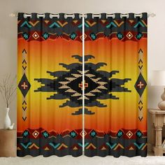 a window curtain with an abstract design in orange, yellow and blue colors on it