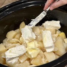 Adding cream cheese and butter to potatoes in a crockpot. Mashed Potatoes In Crock Pot, Instant Mashed Potatoes In Crockpot, Creamy Crockpot Mashed Potatoes, Crock Pot Mashed Potatoes With Cream Cheese, Crock Pot Mashed Potatoes, Mashed Potatoes Cream Cheese, Crockpot Mashed Potatoes Easy Cream Cheese, Crockpot Mashed Potatoes Cream Cheese, Crockpot Mashed Potatoes Sour Cream