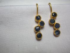 natural blue sapphire earrings  blue sapphire slice  sterling silver 925 gold micron pleating over sterling silver   matt finish polish  length 18 mm  drop length 28 mm approximately  width  5 mm  approximately  if you want any alteration and changes in earrings it can possible with different price and time as custom order. you can contact me by etsy conversation  thank you. feel  free to ask question Elegant Hand Forged Blue Earrings, Blue Hammered Drop Earrings, Elegant Blue Hammered Earrings, Hand Forged Blue Round Earrings, New Design Earrings, Sapphire Earring, Yellow Sapphire Rings, Tourmaline Earrings, Design Earrings