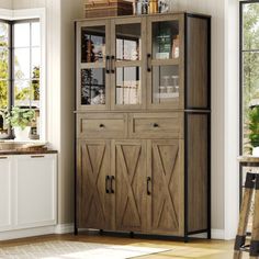 a wooden cabinet with glass doors in a room