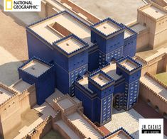 an aerial view of several blue buildings in the middle of a desert area with text that reads national geographic