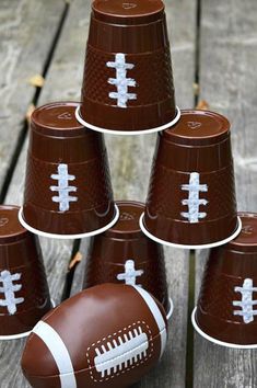 football paper cups are stacked on top of each other