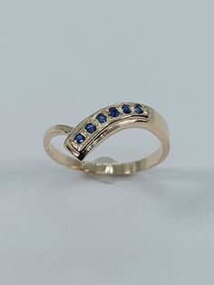 This Handmade Sapphire Ring has been carefully crafted in 10k Yellow Gold, Authentic  Sapphire. This delicate ring would make an amazing birthday/any occasion gift. Ring will be shipped to you in an elegant gift box and it can resized at no extra cost. Once the ring has been mailed a tracking shipping number will be provided to you. Sapphire Measurements: 6 Sapphire: 1.5 mm each stone Ring Weights: 1.6 grams, Ring Size: 6 1/2 Material: Sapphire and 10k Yellow Gold Thanks for visiting my shop! an Blue Birthstone Ring Stamped 14k As Gift, Gold Sapphire Ring, Zierlicher Ring, September Birthstone, Blue Sapphire Rings, Delicate Rings, Multi Stone, Multi Stone Ring, 10k Gold