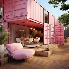 a pink couch sitting on top of a wooden deck