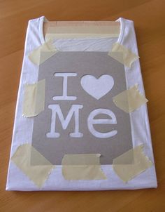 a paper bag with the word i love me cut out on it's side