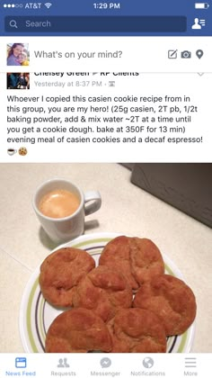 some cookies are on a plate next to a cup of coffee and an email message