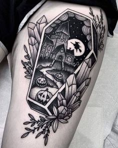 a black and white tattoo with an image of a house in the middle of it