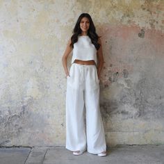 Meet our versatile and timeless Wide Leg Linen Pants Chakra, the perfect addition to your wardrobe. These palazzo style pants are designed with comfort and elegance in mind, offering a combination of convenience and style. Perfect for any occasion, whether you're at a party, in the office, in the city or on vacation, these pants offer a comfortable and feminine look. The wide legs and comfortable elastic waistband with drawstring ensure a relaxed fit, while side pockets provide convenience.  DETAILS :  * Ethically handmade with high quality 100% organic linen, these pants are lightweight and breathable, making them ideal for the warm seasons. *Color : White * Elastic waist with drawstring *Two side pockets SIZE :  * Please pick the size corresponding your measurements in the Size Chart in Linen Pants Set, White Linen Pants Outfit, White Linen Pants Women, Plus Size Bohemian, Plus Size Linen, Palazzo Style, Linen Drawstring Pants, Summer Pants Women, Linen Crop Top