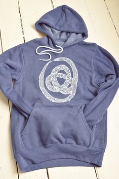 This super soft sponge fleece pullover hoodie is hand printed with our original Ouroboros design in our home studio on the Coast of Maine. It features kangaroo pockets, ribbed cuffs and waistband, has a hood drawstring and is pre-shrunk. Details: * Original Hearth and Harrow Snake design, printed in white * Bella + Canvas Sponge Fleece Hoodie in navy/grey * Eco-friendly, water-based ink * Unisex sizing * Machine wash cold, tumble dry The handmade quality of our products assures that each one is Long Sleeve Fleece Hoodie With Screen Print, Casual Fleece Hoodie With Screen Print, Ouroboros Design, Snake Hoodie, Snake Design, Navy Grey, Print Pullover, Fleece Hoodie, Bella Canvas