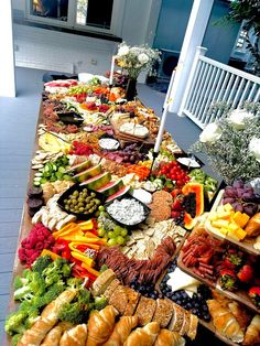 a long table filled with lots of different types of food