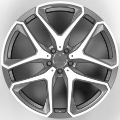 a wheel on a white background with black spokes and silver accents, all in the same color