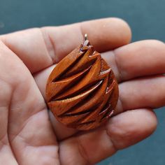 "This unique pendant is hand carved out of beautiful apricot wood. This handmade wooden necklace is one of a kind and is a perfect daily accessory and suitable for special occasions. This wooden pendant is a special gift for him and her. It comes with Korean waxed cord and has lobster clasp at the end. You can chose between several options on how long you want the necklace to be -18\", 20\", 24\", and 30\"  inches . For custom necklace lengths send me a message. If you have any questions about t Unique Natural Wood Pendant Jewelry, Earthy Natural Wood Jewelry For Gifts, Nature-inspired Wooden Pendant Jewelry, Nature-inspired Natural Wood Jewelry With Variations, Nature-inspired Natural Wood Jewelry, Handmade Natural Wood Teardrop Jewelry, Handmade Teardrop Natural Wood Jewelry, Unique Handmade Natural Wood Jewelry, Handmade Artisan Mahogany Jewelry