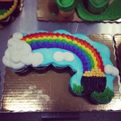 there is a cake shaped like a rainbow