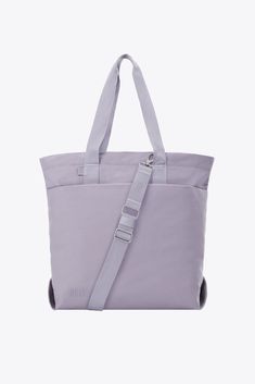 Discover our new utility tote bag in lavender. Perfect for work, travel, or everyday use, shop now for a durable travel tote bag designed to meet all your needs. Functional Weekender Bag With Adjustable Strap, Functional Weekender Bag With Adjustable Strap For Everyday, Versatile Canvas Tote Bag For On-the-go, Versatile Canvas Tote Bag For Everyday Use, Versatile On-the-go Tote Canvas Bag, Everyday Rectangular Canvas Bag With Adjustable Straps, Versatile On-the-go Canvas Tote Bag, Versatile Canvas Tote Bag, Functional Weekender Bag With Double Handle For Everyday