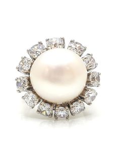 All of the products are MADE TO ORDER in India. They are handcrafted by me and my expert artisan team. Make a statement with our elegant White Freshwater Pearl Ring! Handmade with love, this 925 Sterling Silver ring dazzles with 5A grade Cubic Zirconia diamonds. Perfect for cocktail parties or everyday elegance. Be a show-stopper with our Halo Design Pearl Ring!" SKU: AARC_202 💍Details: *  Gemstone Grade: AAAAA (Natural Diamond Coated) * Base Metal: 925 Sterling Silver * Stone: Cultured Pearl * Shape: Round * Carat Weight: 2.50 ct  * Style: Edwardian PLEASE NOTE 📢 *   This product is completely eco-friendly and non-aggressive to all skin type.  *   It does NOT contain nickel, cadmium, or lead. Explore our stunning collection here: https://etsy.me/3dMqXXW Share your love and experiences w Pearl Halo, White Pearl Ring, Heritage Jewellery, Freshwater Pearl Ring, Historical Jewellery, Halo Design, Jewelry Fashion Trends, Fresh Water Pearl, White Freshwater Pearl