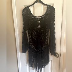 Nwt A Black Crochet Top With Peekaboo Arms, Fringe Sleeves Fringe On The Bottom And Like Around Scooped Neck. It Is Absolutely Gorgeous. Size Medium And It Would Fit A Small To A Medium. Very Cute Layering Piece. I Cannot Fit It. I Bought It And Gained Weight. My Loss Is Your Gain. Black Fitted Crochet Top For Fall, Bohemian Black Tops With Fringe, Black Bohemian Tops With Fringe, Black Crochet Lace Top For Fall, Black Bohemian Open Knit Crochet Top, Bohemian Black Open Knit Crochet Top, Black Bohemian Crochet Top, Bohemian Crochet Tops For Party, Black Fitted Long Sleeve Crochet Top