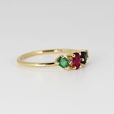 This beautiful cluster ring was made of 14k gold band, 14k gold prong settings. It's perfect as engagement ring or statement piece. DETAILS ABOUT THE RING, MATERIAL AND STONES * 14k 1.2 mm solid gold band and prongs. * 5x3.5 mm oval shape ruby * 4x3 mm oval sapphire * 4x3mm 0val emerald * 2.5mm round emerald * Birthstones : September, May, July We can make this design with any of gemstones. Please contact us. This ring was hand crafted in Melt'm Jewelry Studio in California. Thanks for visiting 14k Gold Birthstone Cluster Ring, Yellow Gold Ruby Cluster Ring For Promise, 14k Gold Cluster Ring With Prong Setting, Yellow Gold Cluster Ruby Promise Ring, Yellow Gold Cluster Rings With Multi-stone, 14k Gold Cluster Ring With Birthstone, Cluster Birthstone Promise Ring With Center Stone, Cluster Multi-stone Diamond Promise Ring, Fine Jewelry Cluster Ruby Promise Ring