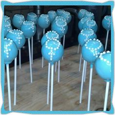 blue cake pops with white polka dots on them