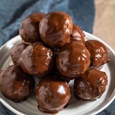 chocolate peanut butter balls on a plate with the words no bake written below it