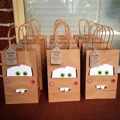 some brown paper bags with faces on them