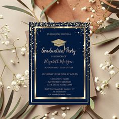 a graduation party card with gold confetti and blue border on the front, surrounded by greenery