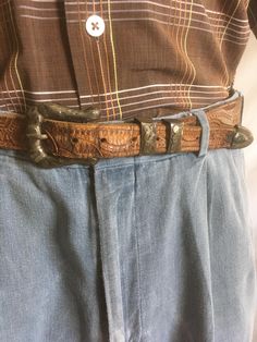 vintage 1940s belt brown tooled leather sterling silver Mexico stamped engraved buckle set- matching buckle, 2 keepers, and tip good vintage condition, w/age wear silver has a beautiful age tarnished patina still functional fits waist sizes 32" to 40" belt measures, approximately 42" x 1 1/4"  buckle measures, approximately 2" x 1 1 7/8" belt has snaps allowing for buckle and keepers removal Rustic Distressed Brown Belt Buckle With Antique Design, Hand-tooled Brown Belt Buckles For Western-themed Events, Rustic Hand Tooled Belt For Western-themed Events, Vintage Engraved Belt Buckles For Rodeo, Southwestern Antique Belt Buckle For Rodeo, Southwestern Hand-tooled Belt Buckle For Western-themed Events, Engraved Brown Belt Buckles For Western-themed Events, Vintage Distressed Brown Belt Buckles, Rustic Antique Buckle Belt For Rodeo