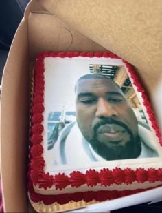 a birthday cake with the image of a man's face on it