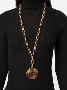 This statement Chanel necklace features a gold-toned chain strap with a CC metal medallion, enamelled in black and red. Fastened using a hook closure, style with your favourite gold-toned jewellery for maximum impact.Condition: Excellent vintage condition. Consistent with age and wear. Chanel Medallion, Chanel Necklace, A Hook, Chain Strap, Chain Necklace, Black And Red, Chanel, Chain, Red