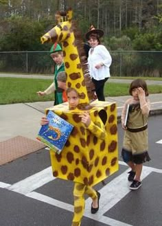 children are dressed up as giraffes in the street