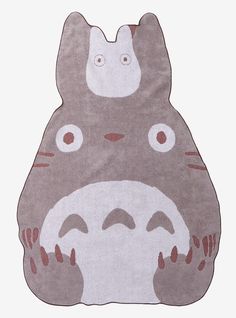 a rug with a totoro face on it