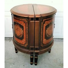 an ornately decorated wooden cabinet with two doors