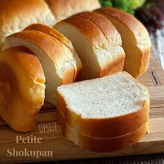 sliced bread on a cutting board with broccoli in the background