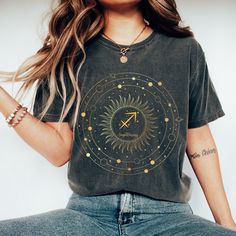 Show off your zodiac sign in style with this unique Zodiac Sagittarius Sign Comfort Colors T Shirt! With its pretty graphic space theme, zodiac symbol print, this is the perfect zodiac gift for the Sagittarius in your life. With a comfortable fit and subtle yet stunning look, this comfortable oversized shirt is sure to make the perfect statement piece. Stand out and make a statement with this astrological piece! ♐T-SHIRT DETAILS Comfort Colors introduces its garment-dyed t-shirt; a fully customizable tee made 100% with ring-spun cotton. The soft-washed, garment-dyed fabric brings extra coziness to your wardrobe while the relaxed fit makes it an excellent daily choice. The double-needle stitching throughout the tee makes it highly durable while the lack of side-seams helps the shirt retain Moon Phases Shirt, Aquarius Gifts, February Birthday Gifts, Sagittarius Sign, Boho Moon, Moon Shirt, Zodiac Sagittarius, Space Theme, Look Plus