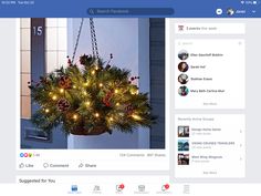 an image of a christmas tree with lights on it's branches and decorations hanging from the ceiling